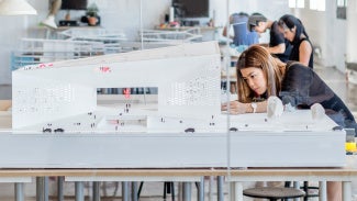 A person works on a model