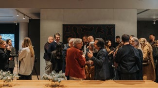 A crowd at a speaker series event