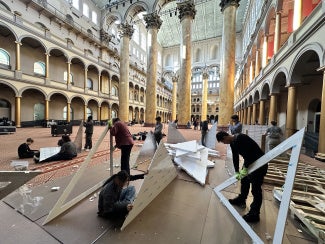 students constructing The Wave exhibit at the National Building Museum
