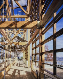 Philip Merrill Environmental Center: Daylighting is maximized by the narrow building depth and expansive south glazing, controlled through deep overhangs and a fixed bris-soleil. 