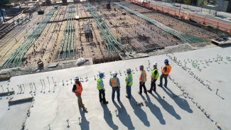 People surveying a construction site