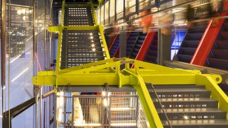 Brightly colored exposed steel in the International Spy Museum. 