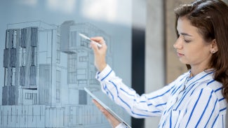 An architect working on a drawing