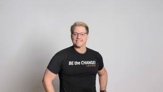 Illya Azaroff, FAIA in a Be the Change shirt