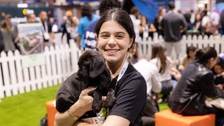 A girl holding a puppy
