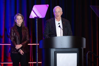 anne marie duvall decker roy decker standing against curtain backdrop architalk