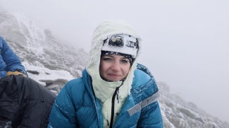 Nicole Becker, AIA, on a cold mountain