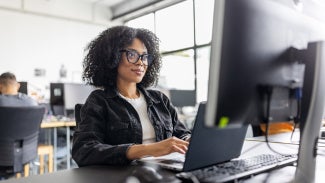 A woman learning at her computer