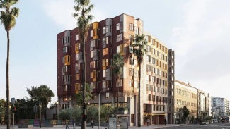 rendering of high-rise affordable housing development with palm trees