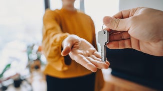 A person receiving keys to a home