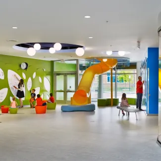 children play in a colorful room