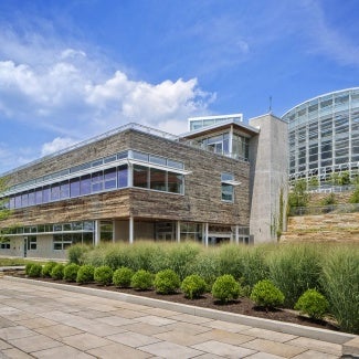 building with green shrubbery out front