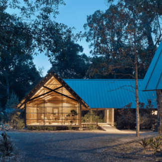 Exterior of modern lake home with large windows