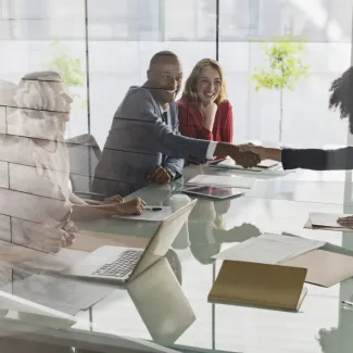 photo of a person shaking hands with other