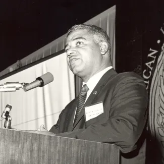 Black and white photo of Whitney M. Young Jr. speaking at the 1968 AIA Convention