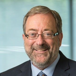 Headshot of man in glasses with beard