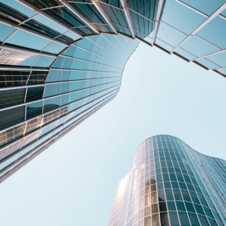 Looking up at sky between two skyscrapers