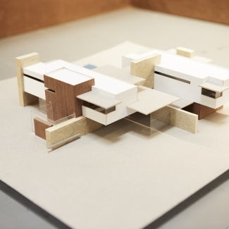 Image of a building model on a blank surface