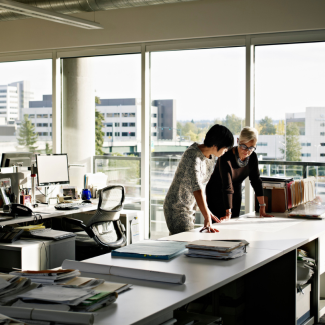 Two architects gathering at a desk