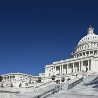 US Capitol against a blue sky. 