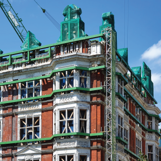 Scaffolding on shell facade of old Victorian palace near Green Park in London, England