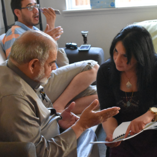 Rania working with a Syrian refugee in Seattle to assist with his family’s resettlement. 