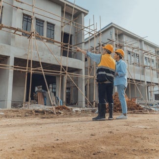architects work on a housing project site