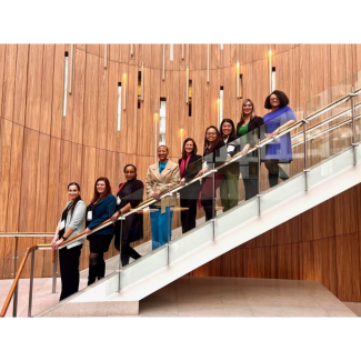 AIA 2023 next to lead class standing top to bottom on a staircase