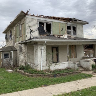 Iowa architect assessing a tornado-damaged home