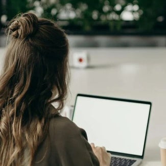Woman at desk on her computer