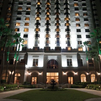 nighttime hotel exterior showcasing lighting