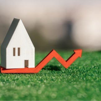 abstract photo illustration rising insurance costs for building