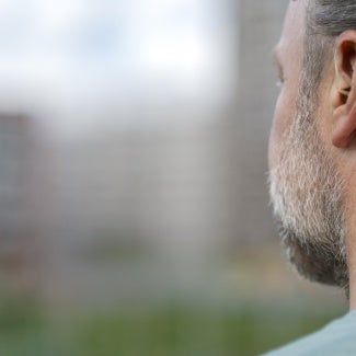 Hearing device in a man's ear