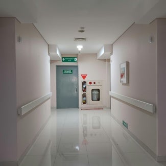 Fire extinguisher and sprinkler system in hospital hallway