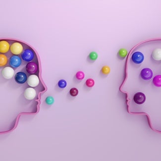 purple background two head outlines containing marbles showing marbles being exchanged via speech