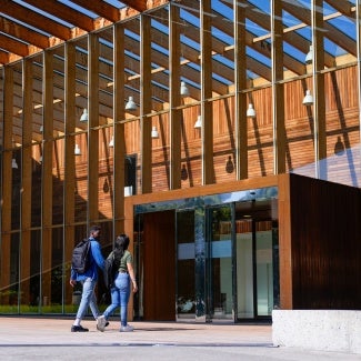 college students entering building