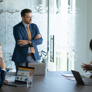 Team members working together at a table in an office setting