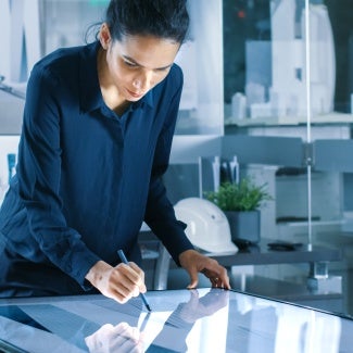 architect looking down at large interactive tablet screen