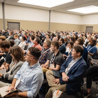 Room full of people at annual business meeting