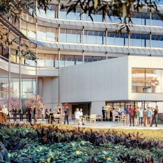 Crowd enjoying a beautiful event on the patio of the AIA Global Campus