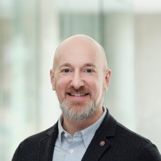 Headshot of Joshua Flowers, FAIA