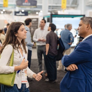 Mentee talking to their mentor at AIA conference