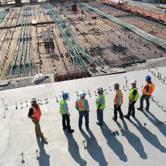 People surveying a construction site