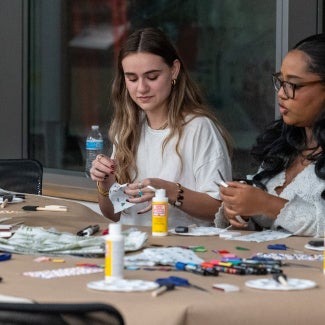 Participants crafting at an event held at the AIA Global Campus