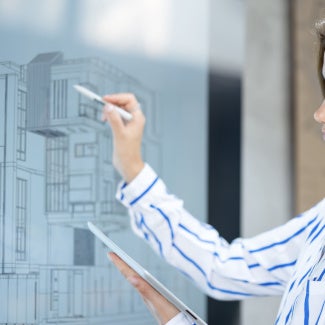 An architect working on a drawing