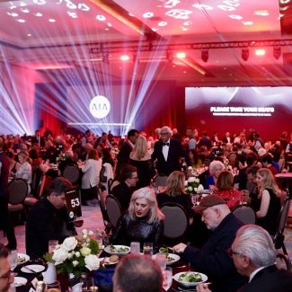A room full people celebrating the 2026 AIA Award recipients.