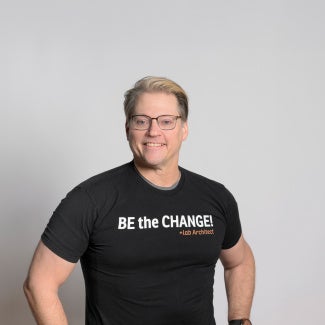 Illya Azaroff, FAIA in a Be the Change shirt