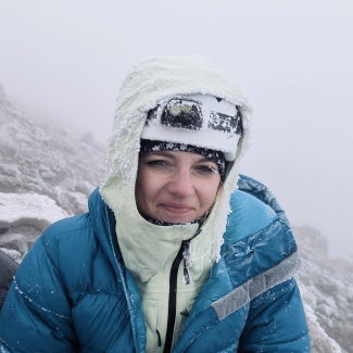 Nicole Becker, AIA, on a cold mountain