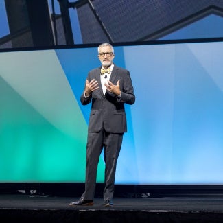 Richard Branch speaking onstage