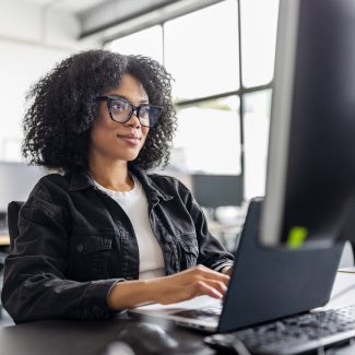A woman learning at her computer